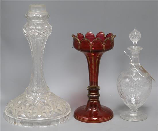 An Edwardian rock crystal glass decanter, a ruby glass lustre and a cut glass lamp base